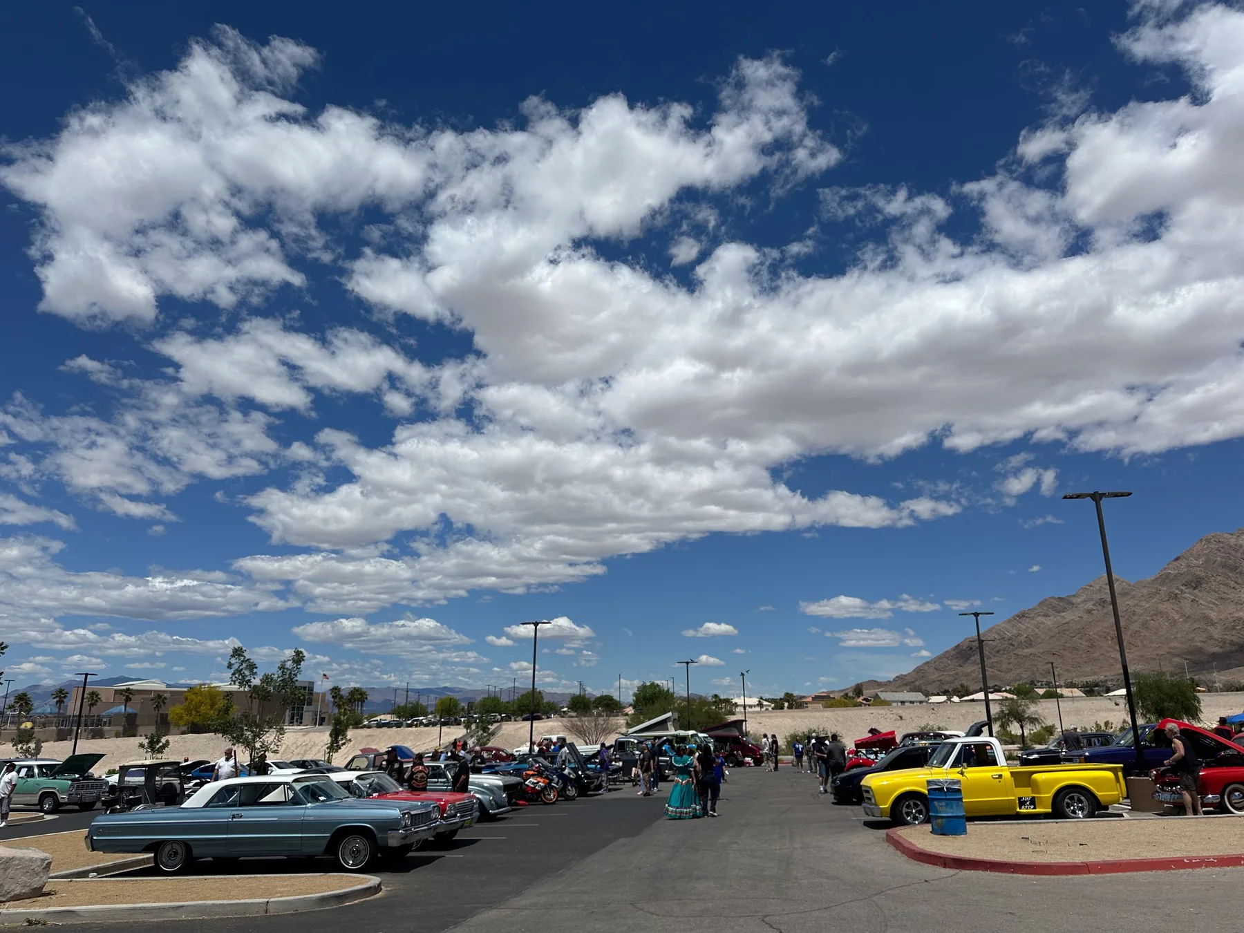 Cars and neighbors at the 2024 East Siders Giving Back car show